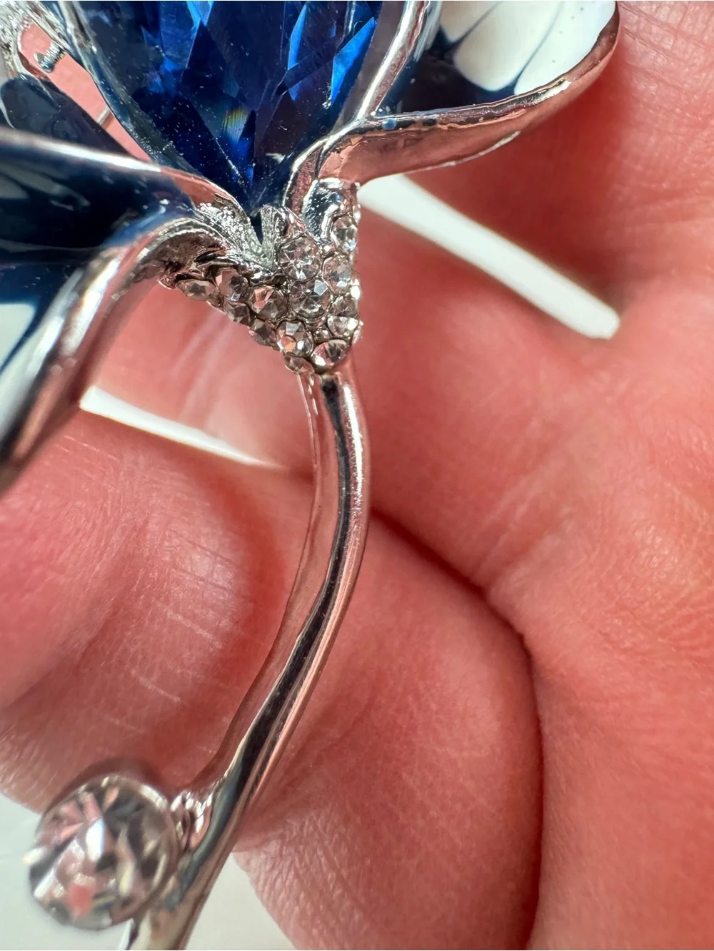 Silver Floral Brooch with Deep Blue Faceted Crystal
